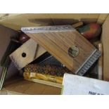 A box of musical instruments and accessories including Zippy Zither