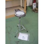 A Roland RMP-5 Rhythm Coach electronic drum pad on stand