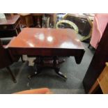 A George III mahogany sofa table the rising leaves over two frieze drawers on twin turned columns