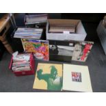 Two cases and a box of LPs including Paul Simon, U2,