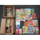 Two boxes of assorted vintage children's annuals and children's books,