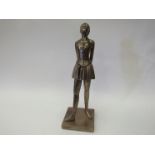 A resin bronze ballerina figure,