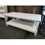 A white painted low coffee table with under tier