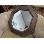 An oak framed mirror,