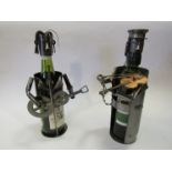 A pair of metal musician wine bottle holders