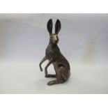A large resin bronze hare on hind legs,