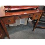 A George III style oak lowboy the three frieze drawers over square tapering legs,