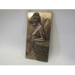 A resin bronze winged fairy figure wall plaque,