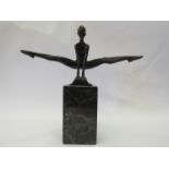 A bronze gymnast on marble plinth,