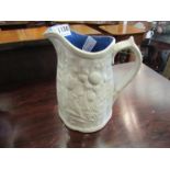 Three embossed jugs, one of corn design,