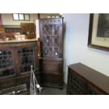 An Old Charm style oak corner cabinet with lead glazed door