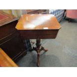 A circa 1840 mahogany two drawer sewing table on turned and carved column with tripod base (two