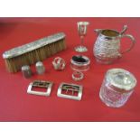 A selection of silver and white metal items including thimbles, lidded pot, shoe buckles,