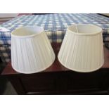 A pair of large cream silk pleated lamp shades,