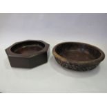 A carved wooden bowl and another