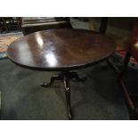 A 19th Century mahogany tilt top low wine table