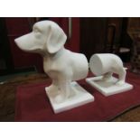 A pair of ceramic bookends in the form of a dog