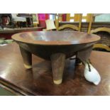 A Fijian kava bowl on four legs, threaded at the front with coconut fibre rope and shell,