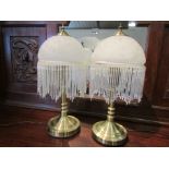 A pair of modern mottled glass table lamps with tassels