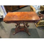 A 19th Century rosewood card table with carved acanthus leaf decoration,