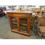 A 19th Century maple pier cabinet with gilt embellishment,