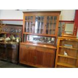 A late 19th Century French mahogany three door panel glazed sideboard,