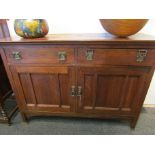 An early 20th Century oak Arts & Crafts sideboard with two drawer two cupboard door base,