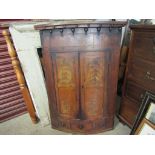 A Victorian mahogany bow front corner cabinet