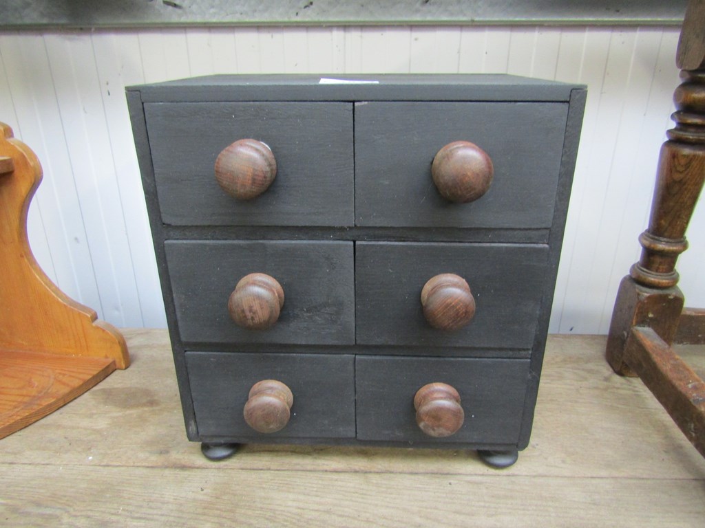 A small black painted bank of six drawers 28.5w x 20.