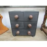 A small black painted bank of six drawers 28.5w x 20.