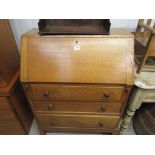 A 1930's oak bureau in the manner of Heals