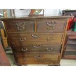 Circa 1900 a mahogany chest of two short over three long drawers with moulded decoration in the