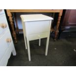 A white painted sewing table