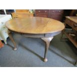 A late Victorian oak d-end dining table with windout mechanism,