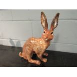 A Winstanley brown hare, 39cm tall,