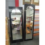 Two ebonised full height wall mirrors