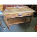 An Edwardian oak hall table with single drawer