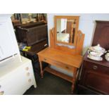 An Edwardian satinwood dressing table with swing mirror,