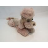 A working vintage Japanese 1950's Cragstan Sleepy Poodle, covered in pink plush.