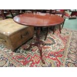 A Georgian mahogany tilt top table with tripod base, 70cm high,