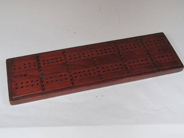 A Victorian inlaid cribbage board,