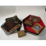 An old lacquer box with wooden chess set, cribbage board, Black Forest bear,