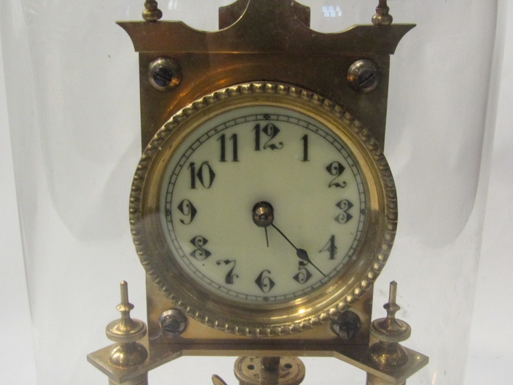 A Continental brass anniversary clock stamped DRGM 403658, with glass dome, - Image 2 of 2