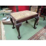 A Victorian stool with needlepoint seat, scroll cabriole legs to claw and ball feet,
