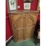 A Georgian pine corner cupboard,