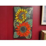 A West German studio pottery style plaque with sunflower detail, 58.5cm x 34.