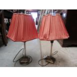 A pair of bronze finish table lamps