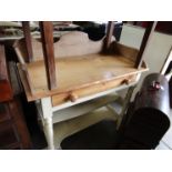 A Victorian pine washstand with shaped gallery back,