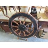 A large iron and elm ships steering wheel 112cm diameter