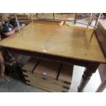 A Victorian pine scrub top kitchen table on original stained legs 89x121cm